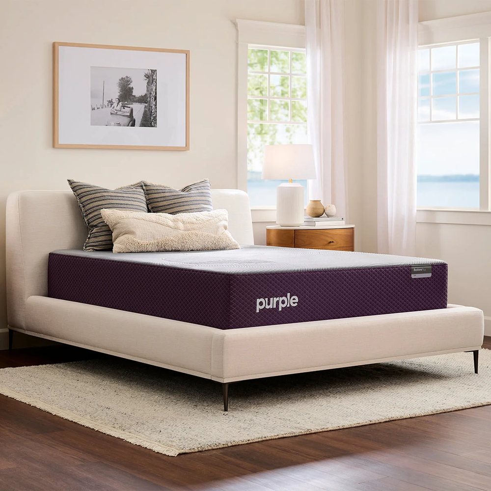 A Purple RestorePlus mattress in a bright bedroom