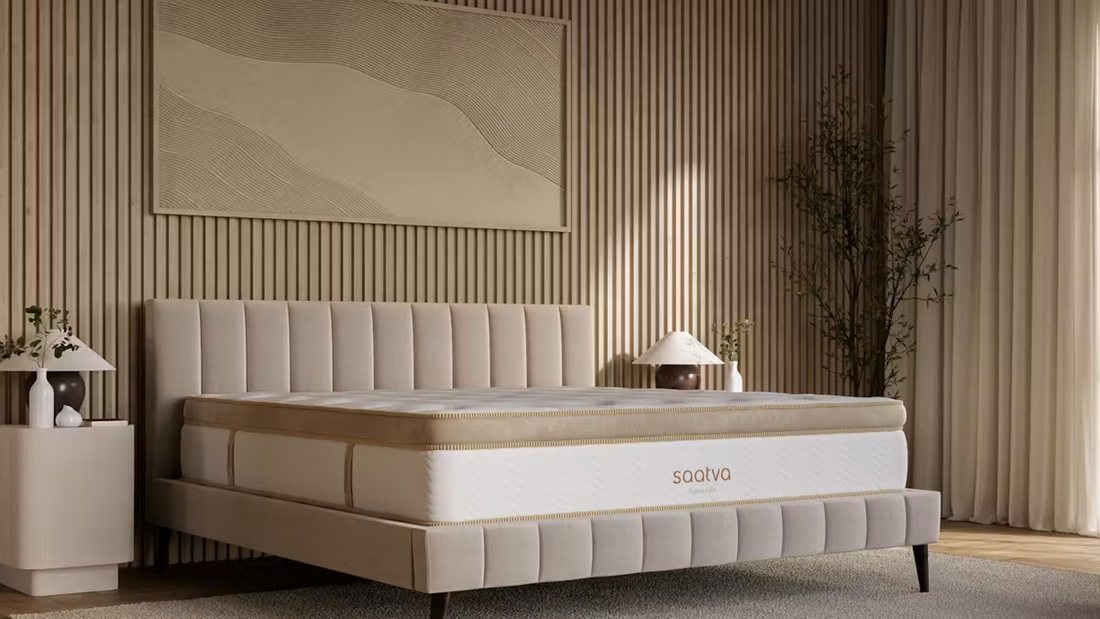 A Saatva Euro pillow-top mattress in a warm neutral bedroom