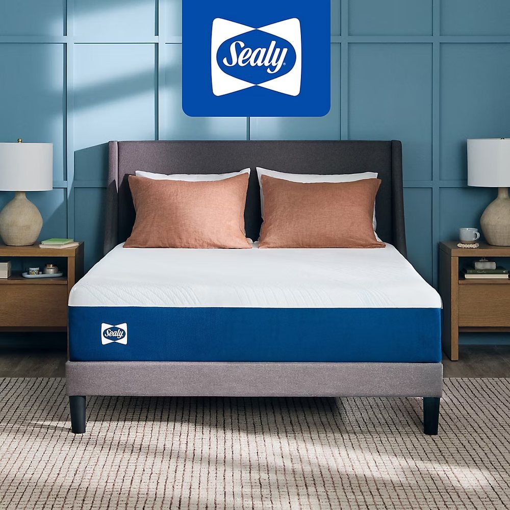 A Sealy memory foam mattress in a blue-panelled bedroom